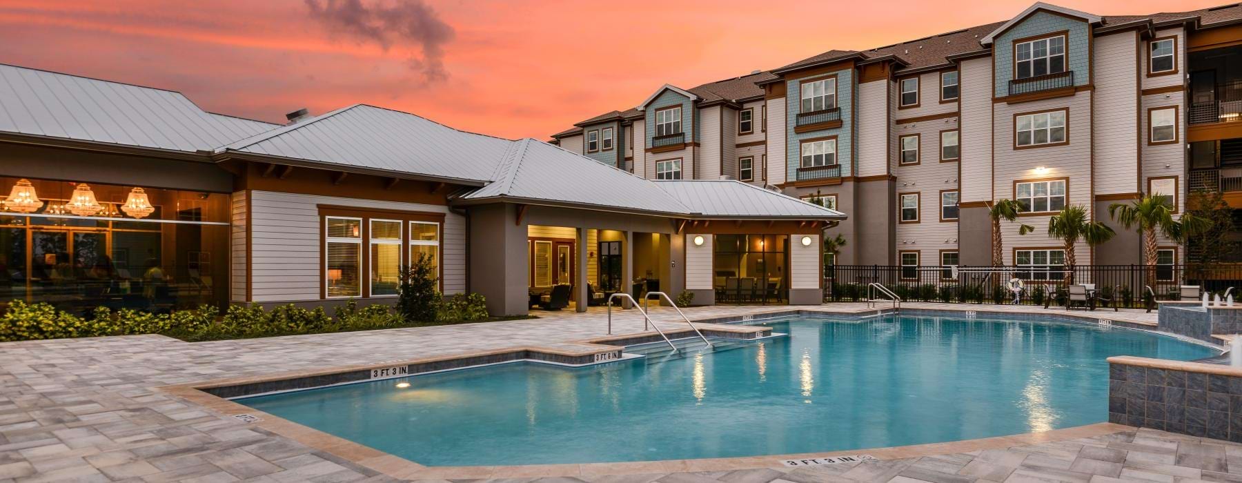 a swimming pool in front of a building