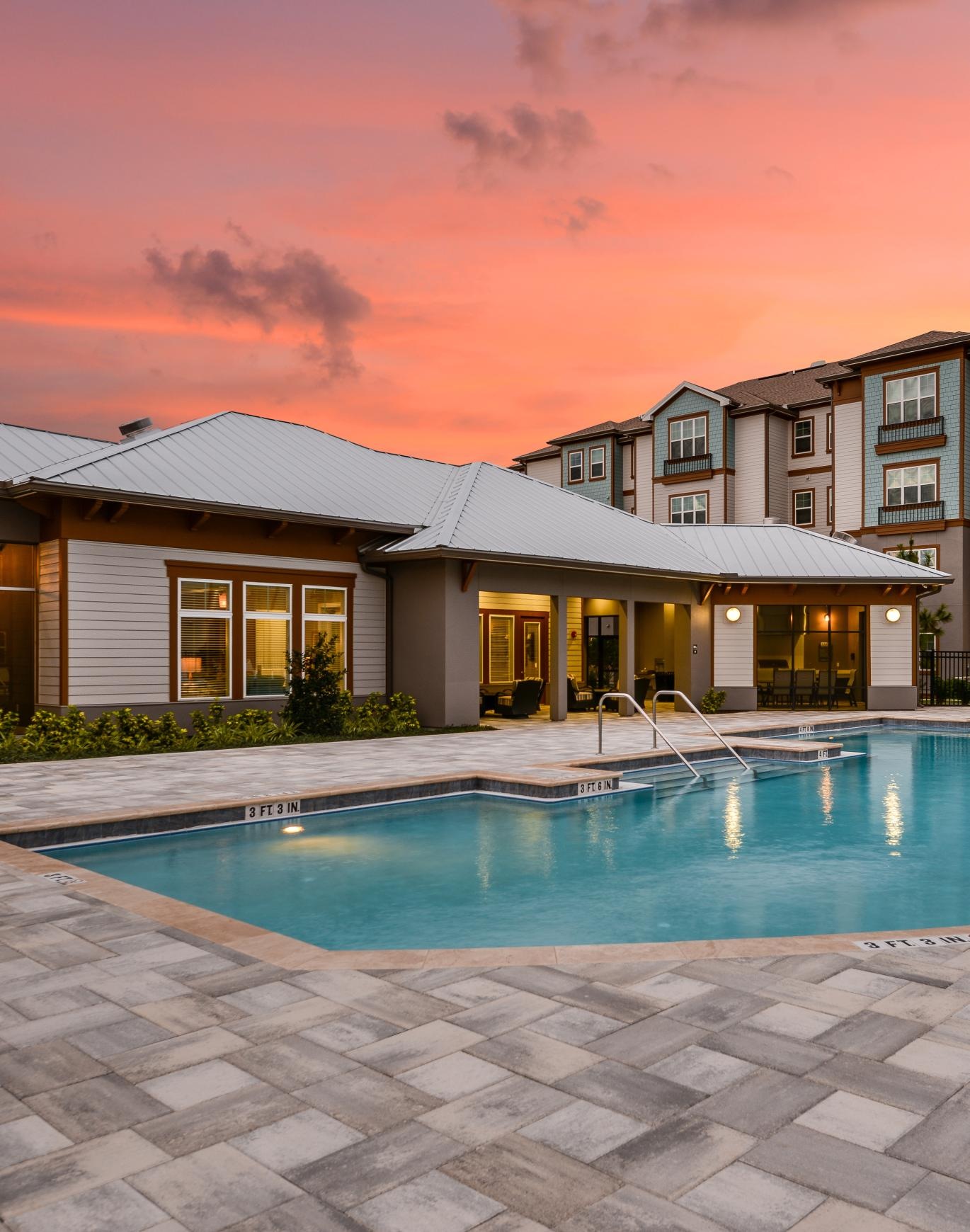 a swimming pool in front of a building