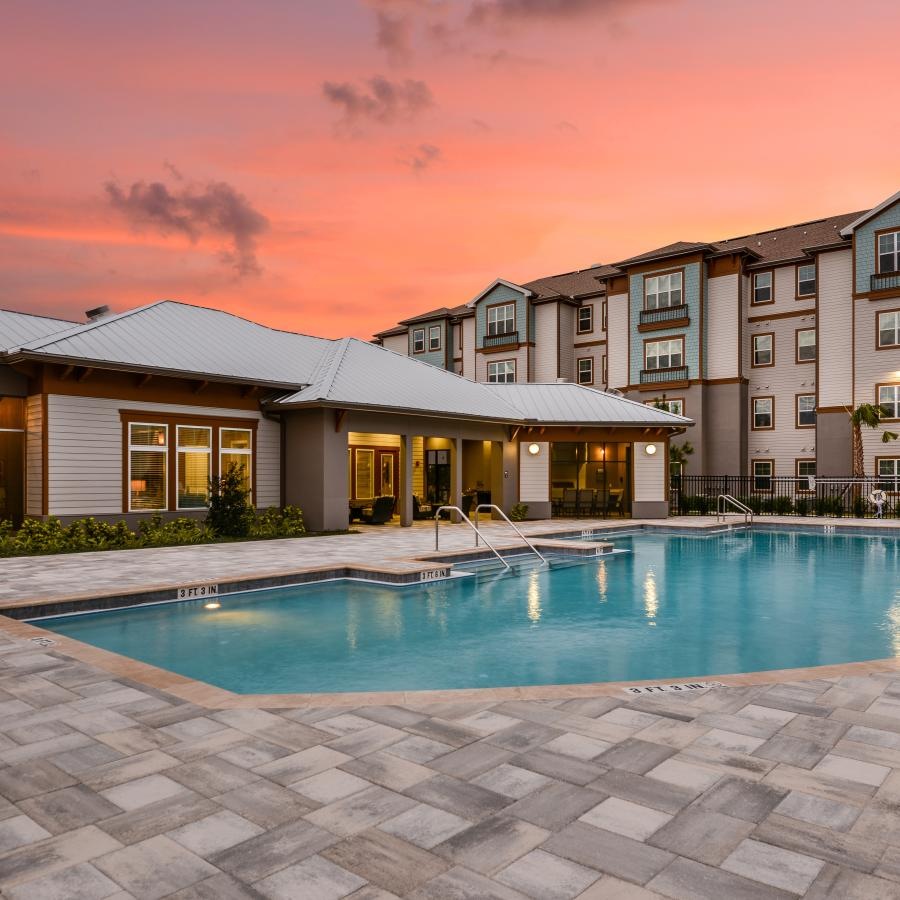 a swimming pool in front of a building
