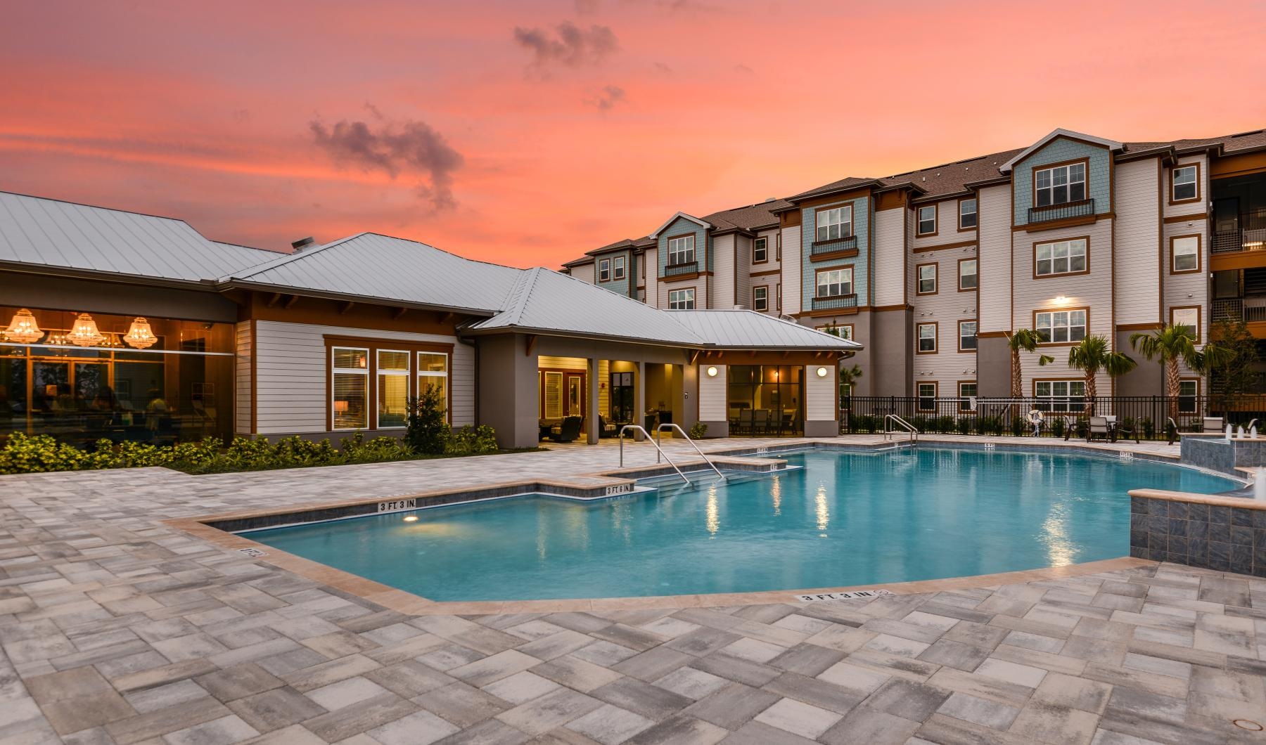 a swimming pool in front of a building